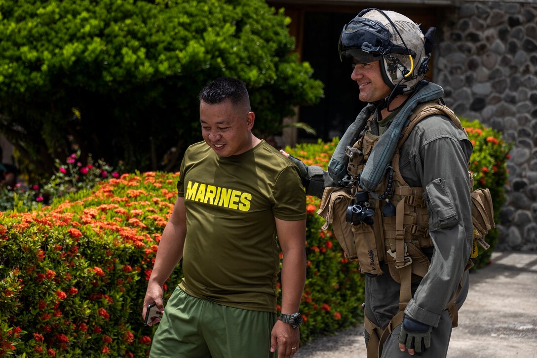 U.S. Marine Corps Lt. Col. David Batcheler, commanding officer of Marine Medium Tiltrotor Squadron (VMM) 163 (Reinforced), Marine Aircraft Group 16, 3rd Marine Aircraft Wing, speaks with a Philippine Marine while conducting relief efforts in the wake of Typhoon Egay, international name Typhoon Doksuri, in Basco, Batanes province, Philippines, Aug. 1, 2023. At the request of the Armed Forces of the Philippines, U.S. Marines are providing relief and lifesaving capabilities to remote regions of the Philippines. The forward presence and ready posture of I Marine Expeditionary Force assets in the region facilitated rapid and effective response to crisis, demonstrating U.S. commitment to Allies and partners. During the first two days of relief efforts, VMM-163 (Rein.) delivered approximately 25,600 pounds of food and water, provided by the Government of the Philippines, to remote, affected communities. Batcheler is a native of The Woodlands, Texas. (U.S. Marine Corps photo by Sgt. Sean Potter)