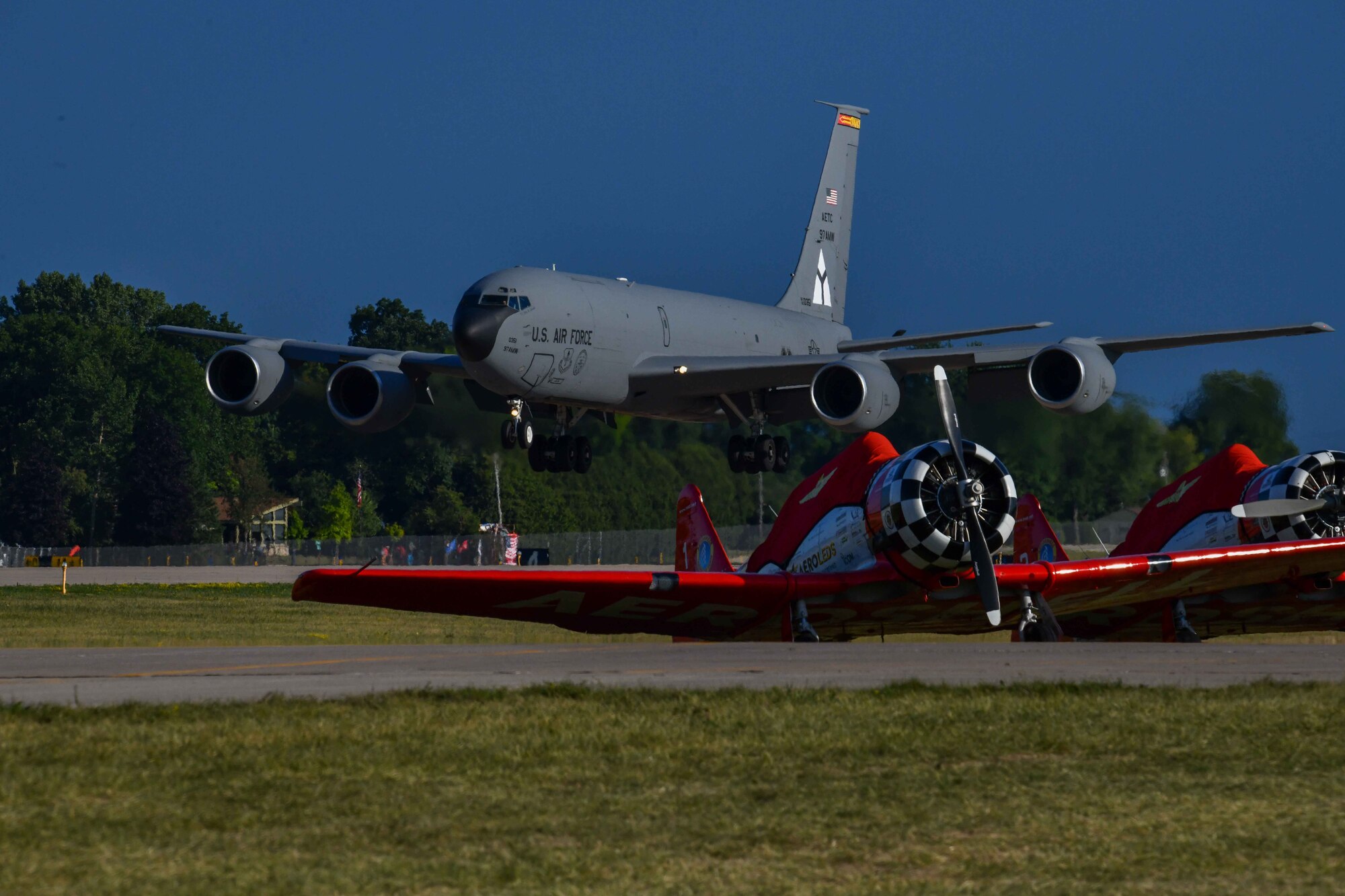 A KC-135 Stratotanker from Altus Air Force Base, Oklahoma, performs a landing attitude demo during an Experimental Aviation Association AirVenture Air Show in Oshkosh, Wisconsin, July 29, 2023. This year marked the first time Lt. Gen. Brian Robinson, Air Education, and Training Command commander, saw the joint profile of the C-17 Globemaster III and KC-135 demo team.  (U.S. Air Force photo by Airman 1st Class Karalyn Degraffenreed)