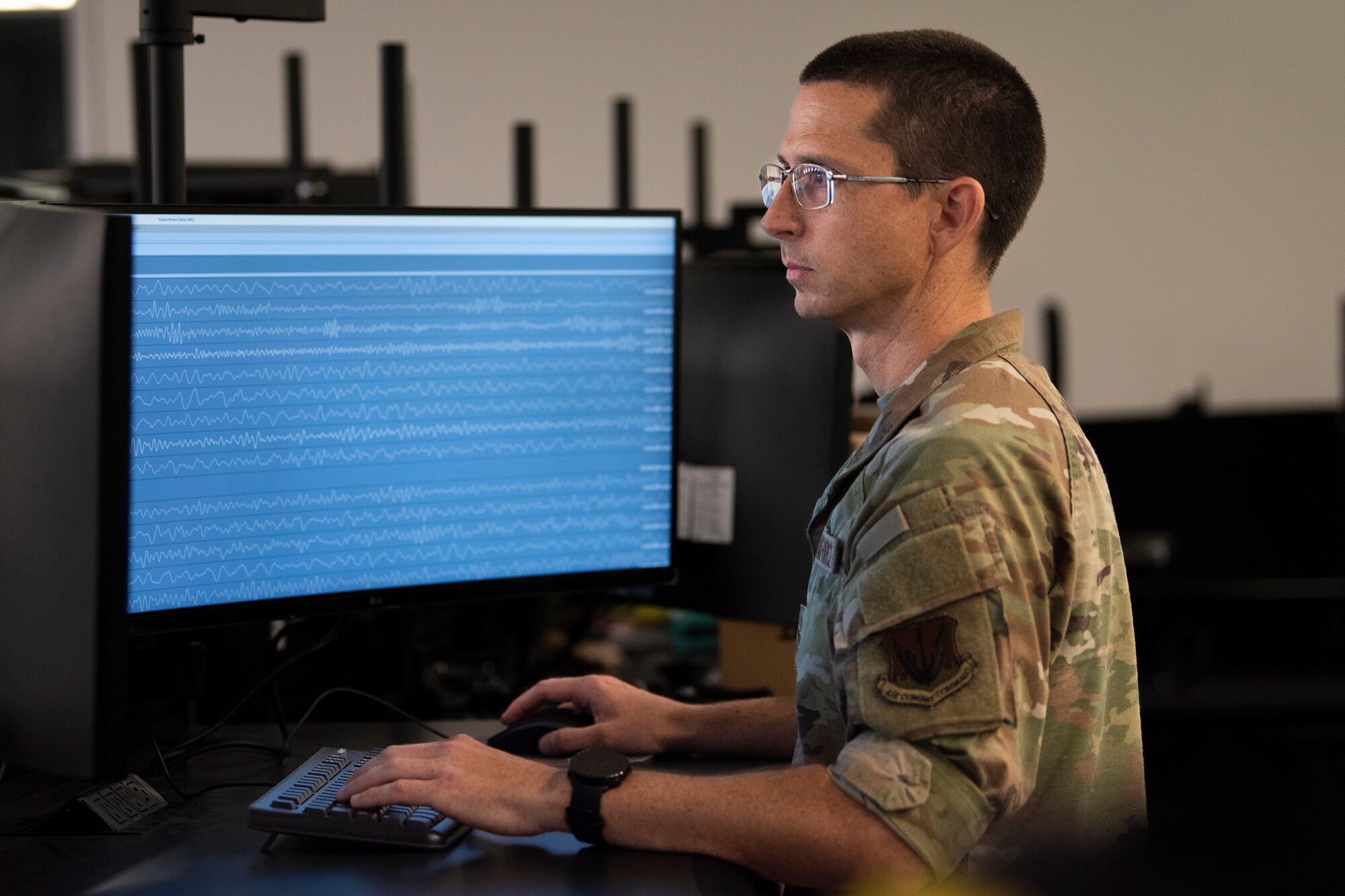 Airman 1st Class Ryan Miskowiec, a Scientific Applications Specialist assigned to the 22nd Surveillance and Analysis Squadron, analyzes seismic phenomenology as part of his job at the Air Force Technical Applications Center, Patrick Space Force Base, Fla.  Miskowiec, who has a doctorate degree in Kinesiology, has been with the nuclear treaty monitoring center since May 2023 and is the oldest E-3 in his organization.  (U.S. Air Force photo by Matthew S. Jurgens)
