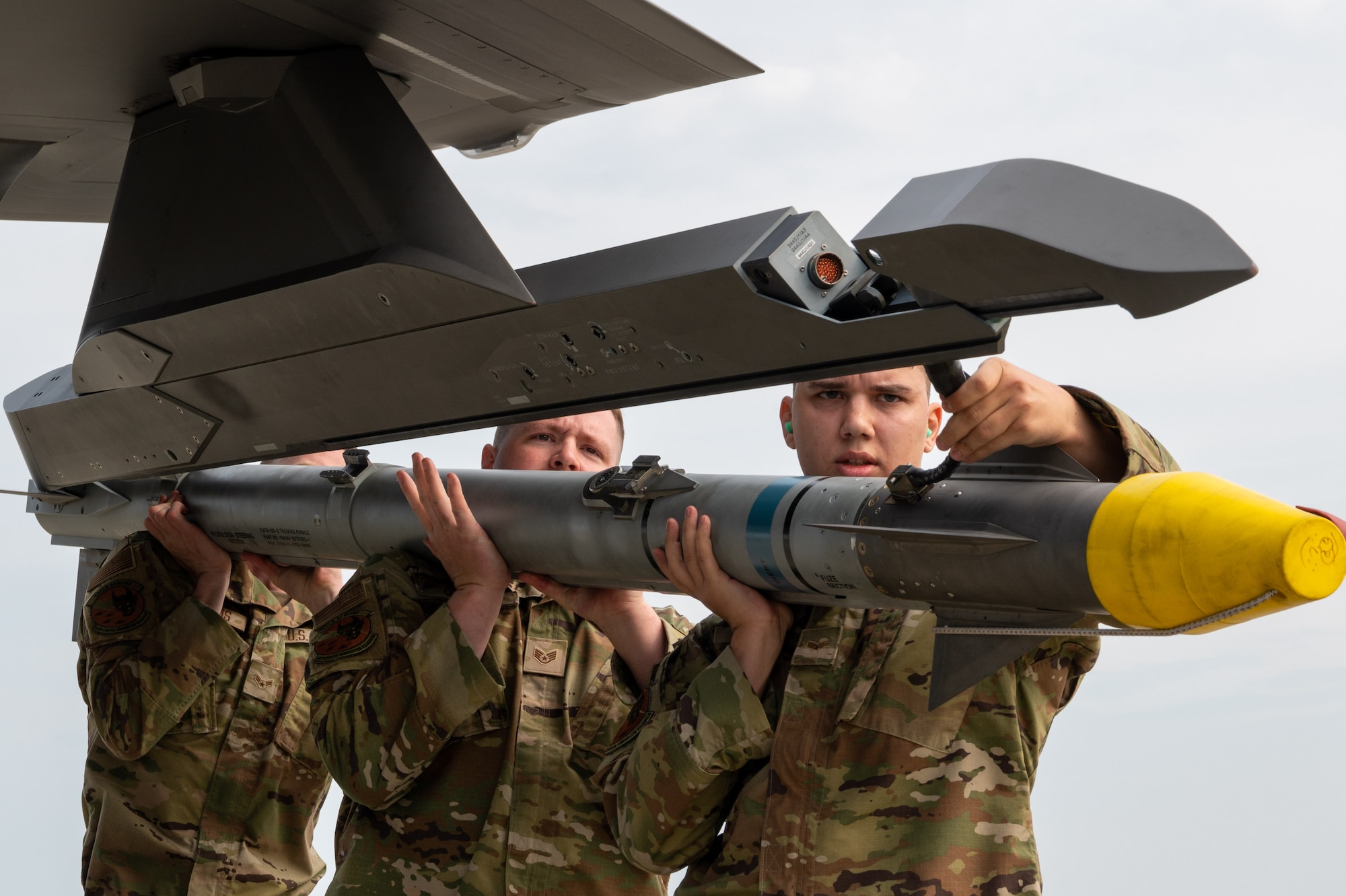 Load team assigned to the 356th Fighter Generation Squadron, Eielson AFB, load a training missile during a load competition at JBER, July 28, 2023
