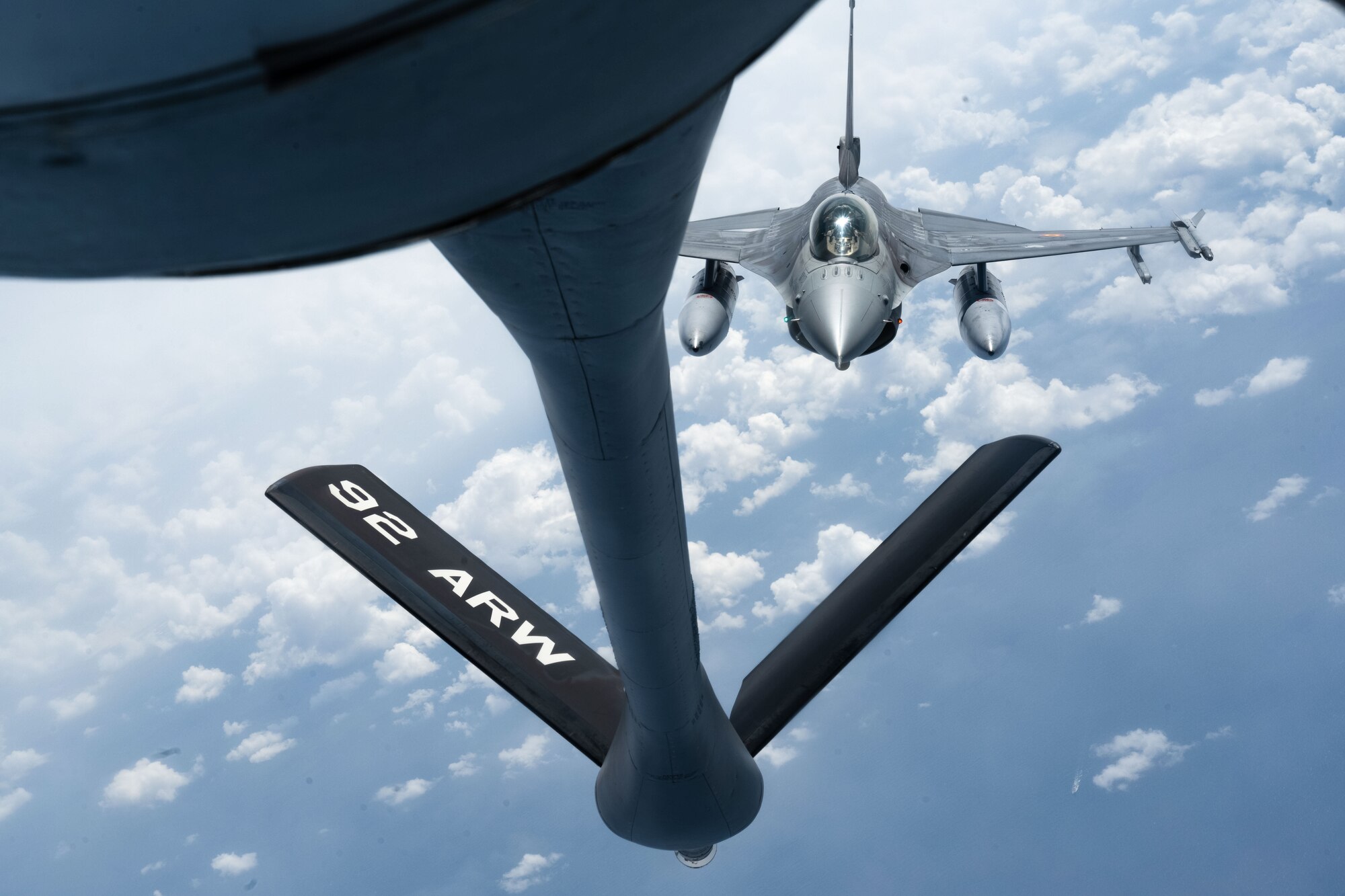 A Belgian Air Force F-16 approaches a U.S. Air Force KC-135 Stratotanker for an aerial refueling over the North Sea