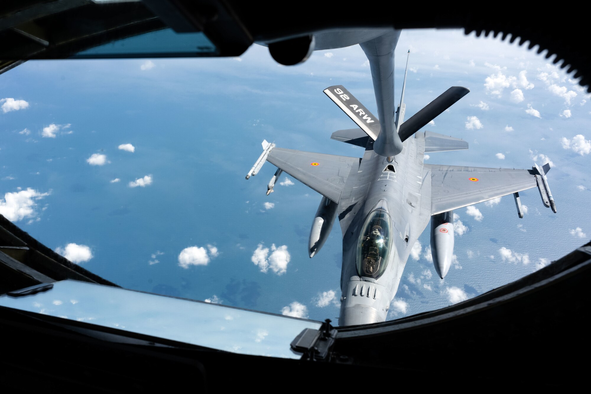 A Belgian Air Force F-16 gets refueled over the North Sea