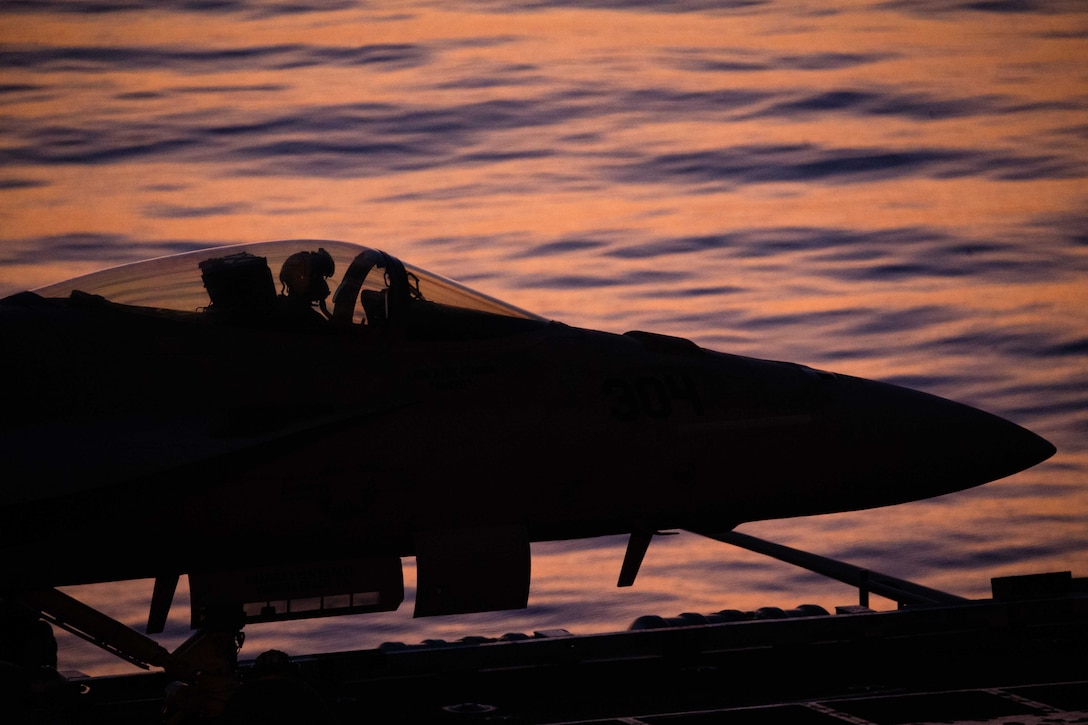 A pilot sits in a F/A-18E Super Hornet preparing for takeoff.