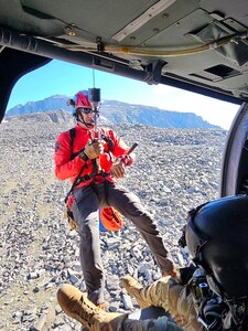 A Big Horn County Search and Rescue team member is hoisted from a Wyoming Army National Guard Black Hawk UH-60 helicopter during a medevac mission to rescue an injured 18-year-old man stranded on Cloud Peak at 12,200 feet July 26, 2023.