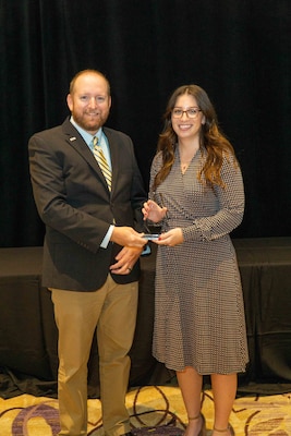 Nicole Bohaczyk receives the 2023 Government Engineer of the Year Award at the ASCE annual conference in Orlando, Fla.  (Photo credits to Bruce Layfield Photography)