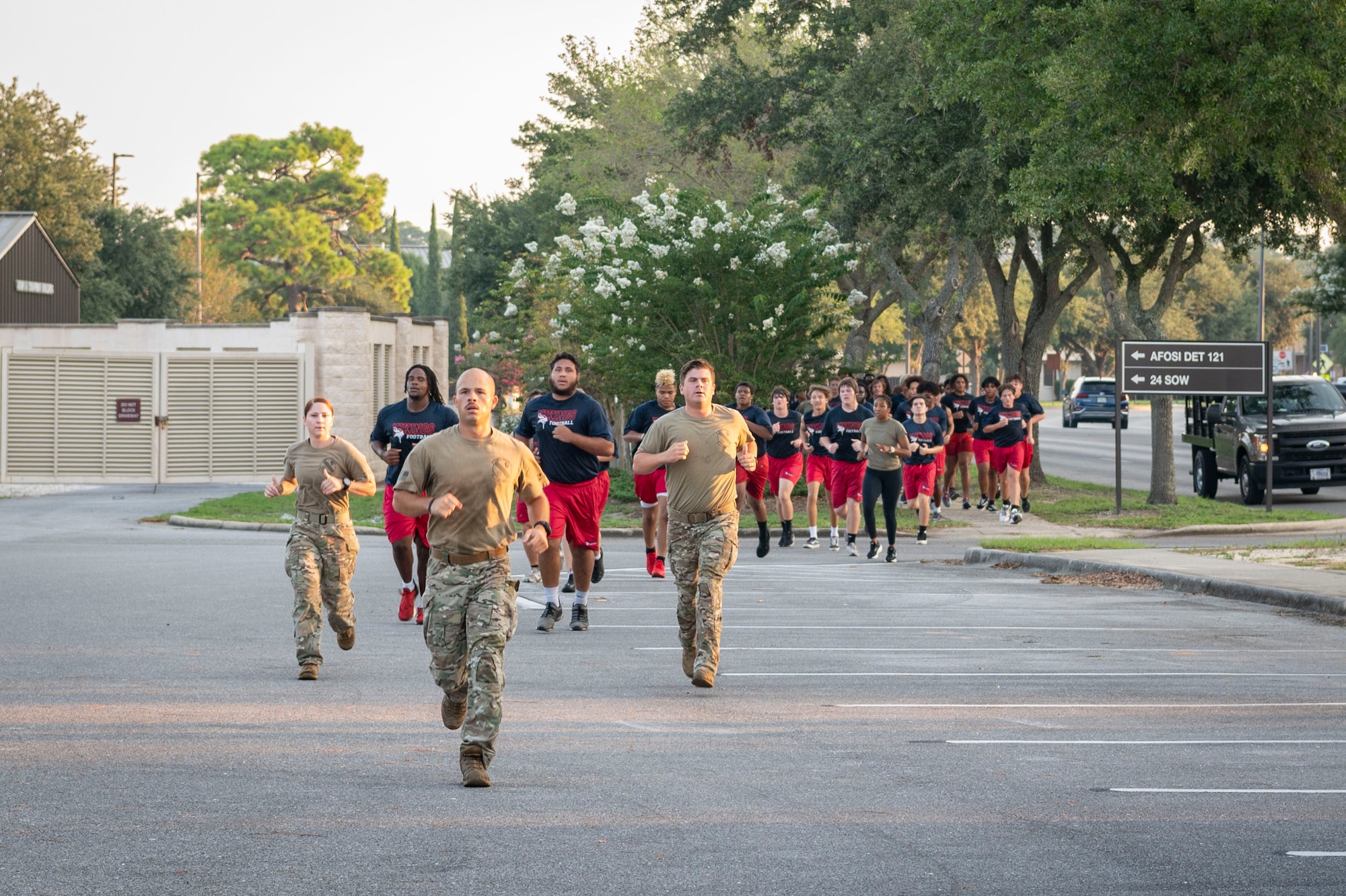 The Fort Walton Beach High School Vikings football team does a formation run during Air Commando Youth Athletic Camp at Hurlburt Field, Florida, July 26, 2023.