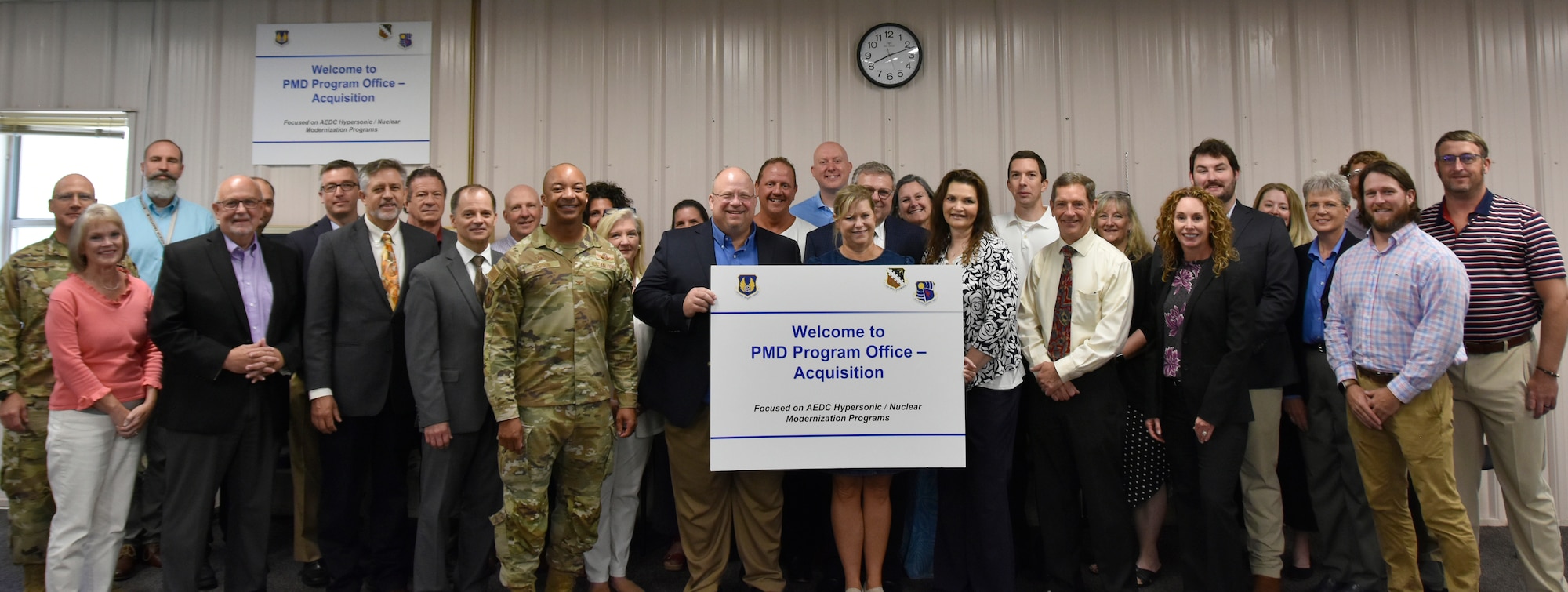 Arnold Engineering Development Complex leadership and Program Management Office personnel pose for a group photograph July 13, 2023, following a ribbon cutting for the Acquisition Branch office at Arnold Air Force Base, Tenn. The Acquisition Branch, part of the Program Management Office, will be tasked with leading the revitalization, development, delivery and installation of programs within the ground test capabilities across AEDC, and ensuring key program milestones are met within cost, schedule and performance requirements while adhering to quality, safety and technical standards to meet the demands of the National Defense Strategy. The goal of the Acquisition Branch team is to increase test capabilities throughout AEDC to help the U.S. Air Force remain competitive with near-peer adversaries. (U.S. Air Force photo by Bradley Hicks)