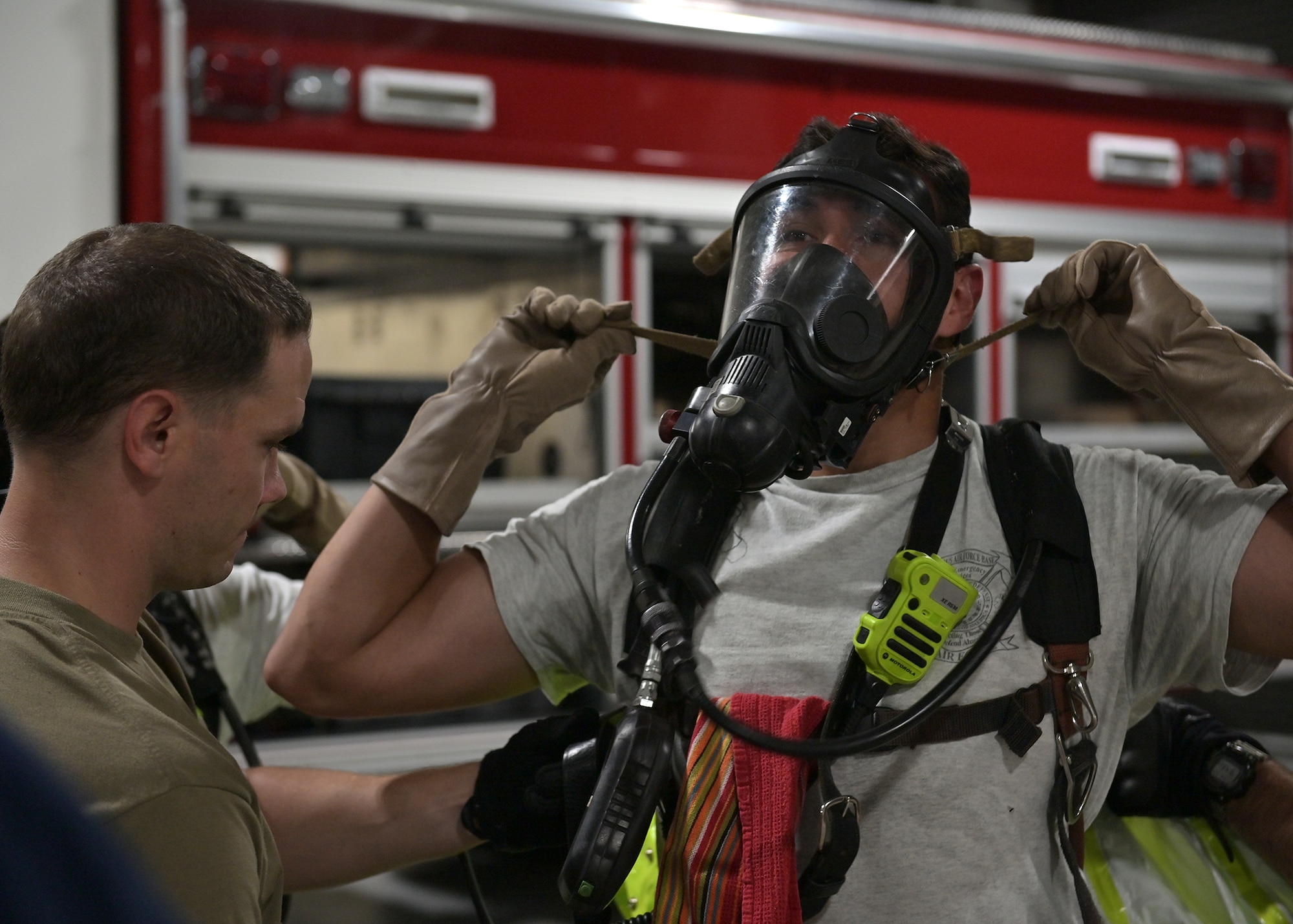 Firefighters put on protective equipment.