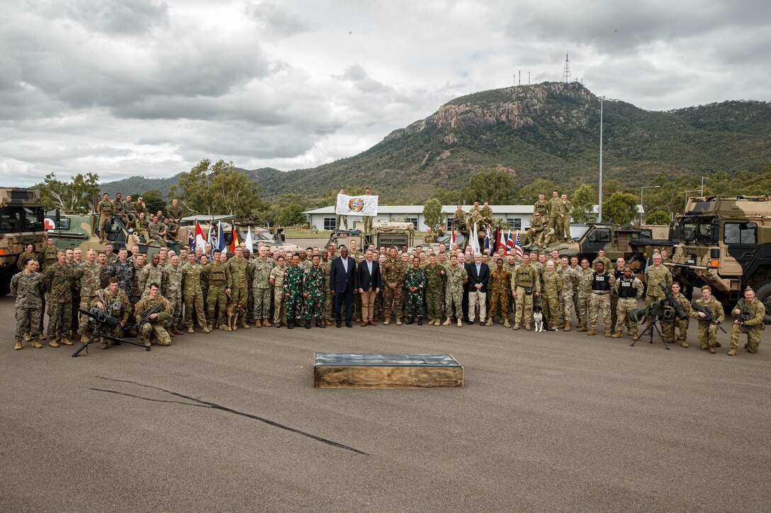 Service members and civilian leaders from multiple nations, including U.S. Secretary of Defense Lloyd J. Austin III,  pose for a photo at Lavarack Barracks as part of Exercise Talisman Sabre 23 in Townsville, Australia, July 30, 2023. Talisman Sabre is the largest bilateral military exercise between Australia and the United States advancing a free and open Indo-Pacific by strengthening relationships and interoperability among key Allies and enhancing our collective capabilities to respond to a wide array of potential security concerns. (U.S. Marine Corps photo by Cpl. Emeline Molla)
