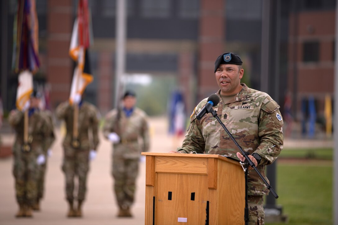 V Corps' outgoing command sergeant major, Command Sgt. Maj. Raymond Harris, addresses the audience during a change of responsibility ceremony at V Corps Headquarters, Fort Knox, Kentucky, Aug. 4, 2023. V Corps conducted a change of responsibility ceremony for Harris, who released responsibility to Command Sgt. Maj. Philip Blaisdell. (U.S. Army photo by Sgt. Gabriella Sullivan)