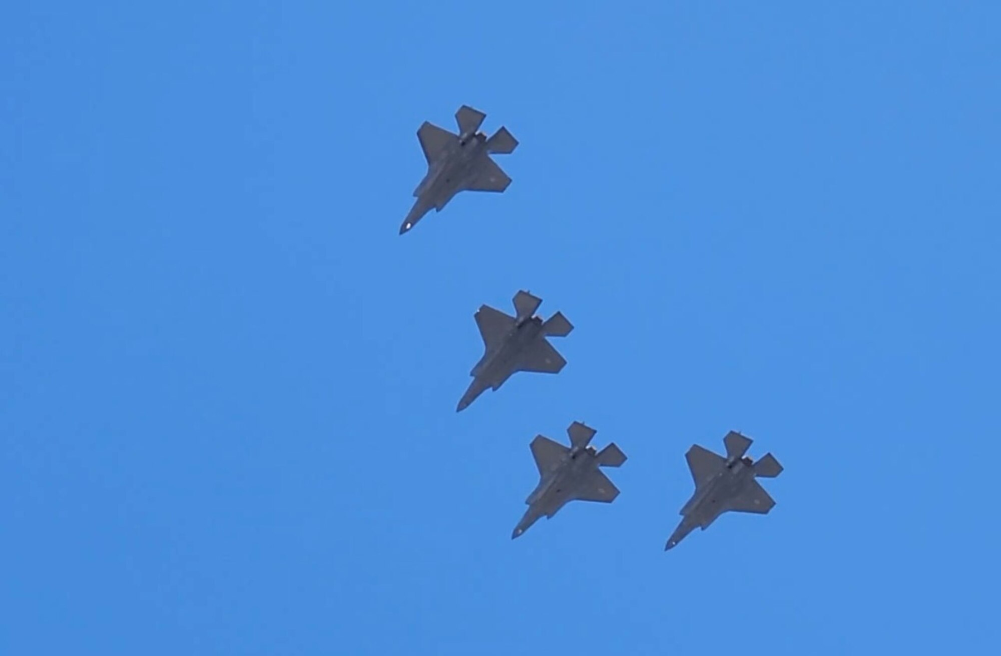 Four U.S. Air Force F-35A Lightning II aircraft flyover the 10 year memorial event for the Granite Mountain Hotshots at Prescott, Arizona, June 30, 2023.