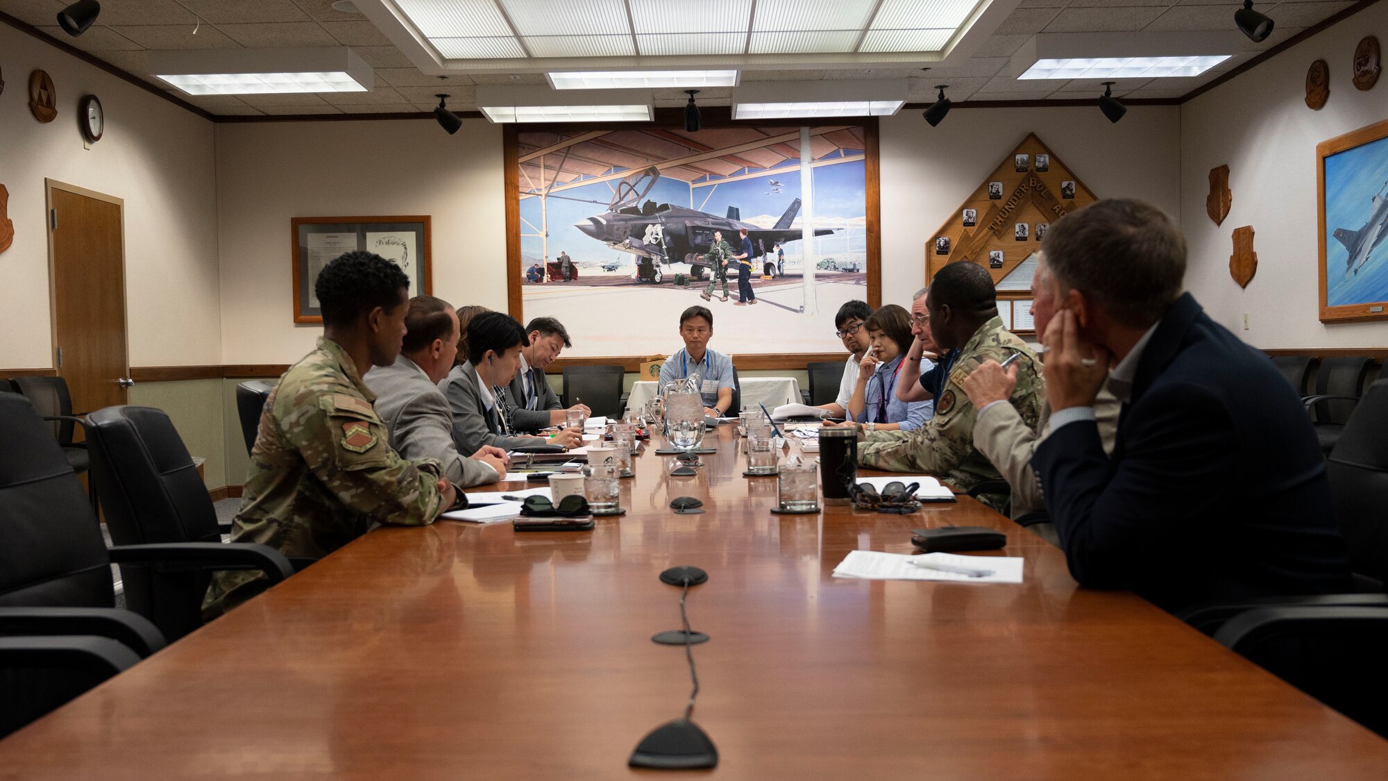56th Fighter Wing personnel and Japanese civic leaders part of the U.S. Department of State’s International Visitor Leadership Program discuss current practices for community engagement at Luke Air Force Base, Arizona, on Aug. 2, 2023.