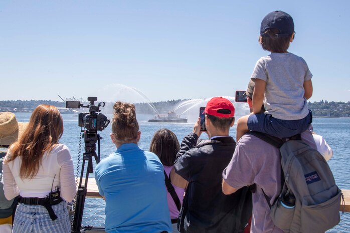 230801-N-YF131-1305 SEATTLE (Aug. 1, 2023) Civilians watch as the Seattle Fire and Rescue Fire Boat Leschi sprays water for Seattle Fleet Week, Aug. 1, 2023. Seattle Fleet Week is a time-honored celebration of the sea services and provides an opportunity for the citizens of Washington to meet Sailors, Marines and Coast Guardsmen, as well as witness firsthand the latest capabilities of today’s U.S. and Canadian maritime services. (U.S. Navy photo by Mass Communication Specialist 2nd Class Madison Cassidy)