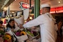 230802-N-YF131-1090 SEATTLE (Aug. 2, 2023) Cryptologic Technician (Collection) Seaman Kaden Boyce, from Front Royal, Va., assigned to the Arleigh Burke-class guided missile destroyer USS Barry (DDG 52) buys flowers at Pike Place Market during Seattle Fleet Week, Aug. 2, 2023. Seattle Fleet Week is a time-honored celebration of the sea services and provides an opportunity for the citizens of Washington to meet Sailors, Marines and Coast Guardsmen, as well as witness firsthand the latest capabilities of today’s U.S. and Canadian maritime services. (U.S. Navy photo by Mass Communication Specialist 2nd Class Madison Cassidy)