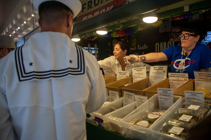 230802-N-YF131-1102 SEATTLE (Aug. 2, 2023) Sailors, assigned to the Arleigh Burke-class guided missile destroyer USS Barry (DDG 52) visit Pike Place Market during Seattle Fleet Week, Aug. 2, 2023. Seattle Fleet Week is a time-honored celebration of the sea services and provides an opportunity for the citizens of Washington to meet Sailors, Marines and Coast Guardsmen, as well as witness firsthand the latest capabilities of today’s U.S. and Canadian maritime services. (U.S. Navy photo by Mass Communication Specialist 2nd Class Madison Cassidy)