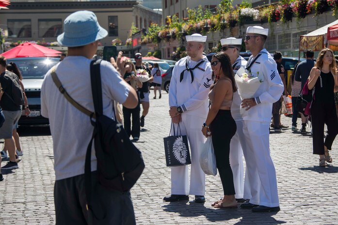 230802-N-YF131-1118 SEATTLE (Aug. 2, 2023) Sailors, assigned to the Arleigh Burke-class guided missile destroyer USS Barry (DDG 52) visit Pike Place Market during Seattle Fleet Week, Aug. 2, 2023. Seattle Fleet Week is a time-honored celebration of the sea services and provides an opportunity for the citizens of Washington to meet Sailors, Marines and Coast Guardsmen, as well as witness firsthand the latest capabilities of today’s U.S. and Canadian maritime services. (U.S. Navy photo by Mass Communication Specialist 2nd Class Madison Cassidy)