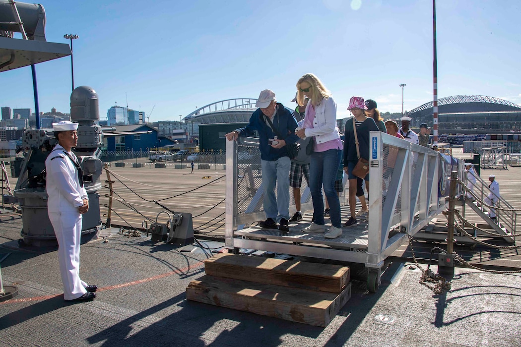 SEATTLE (Aug. 3, 2023) Civilians step aboard the Arleigh Burke-class guided missile destroyer USS Barry (DDG 52) for open ship tours during Seattle Fleet Week, Aug. 3, 2023. Seattle Fleet Week is a time-honored celebration of the sea services and provides an opportunity for the citizens of Washington to meet Sailors, Marines and Coast Guardsmen, as well as witness firsthand the latest capabilities of today’s U.S. and Canadian maritime services. (U.S. Navy photo by Mass Communication Specialist 2nd Class Madison Cassidy)