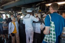 SEATTLE (Aug. 3, 2023) Electronic Technician 1st Class Jean Paulynice, center, from Brooklyn, assigned to the Arleigh Burke-class guided missile destroyer USS Barry (DDG 52) leads ship tours during Seattle Fleet Week, Aug. 3, 2023. Seattle Fleet Week is a time-honored celebration of the sea services and provides an opportunity for the citizens of Washington to meet Sailors, Marines and Coast Guardsmen, as well as witness firsthand the latest capabilities of today’s U.S. and Canadian maritime services. (U.S. Navy photo by Mass Communication Specialist 2nd Class Madison Cassidy)