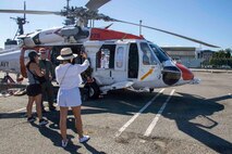 230803-N-YF131-1056 SEATTLE (Aug. 3, 2023) Civilians tour an MH-60S Sea Hawk helicopter, assigned to Naval Air Station Whidbey Island Search and Rescue during Seattle Fleet Week, Aug. 3, 2023. Seattle Fleet Week is a time-honored celebration of the sea services and provides an opportunity for the citizens of Washington to meet Sailors, Marines and Coast Guardsmen, as well as witness firsthand the latest capabilities of today’s U.S. and Canadian maritime services. (U.S. Navy photo by Mass Communication Specialist 2nd Class Madison Cassidy)