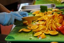 A U.S. Marine Corps food service specialist with Service Company, Headquarters Battalion, prepares food during a Chef of the Quarter competition, Marine Corps Base Hawaii, July 28, 2023. The competition provided an opportunity for food service specialists to hone their craft while fostering esprit de corps. (U.S. Marine Corps photo by Lance Cpl. Hunter Jones)