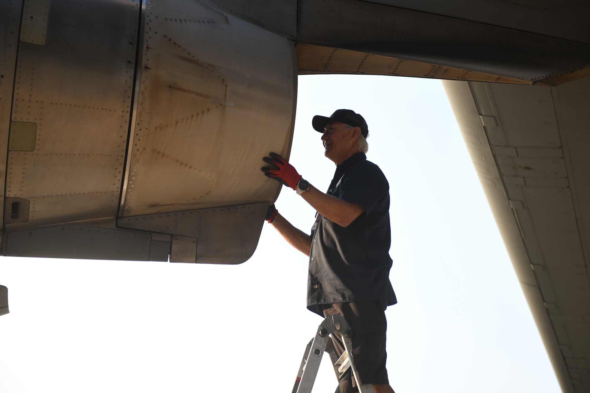 Jay Chase, the 97th Aircraft Maintenance Squadron aircraft technician, inspects the engine of a C-17 Globemaster III prior to takeoff in Oshkosh, Wisconsin, July 31, 2023. Maintenance teams joined the aircrews for the Experimental Aviation Association AirVenture Air Show to perform functional checks, inspections and maintenance before, during and after flights. (U.S. Air Force photo by Airman 1st Class Miyah Gray)
