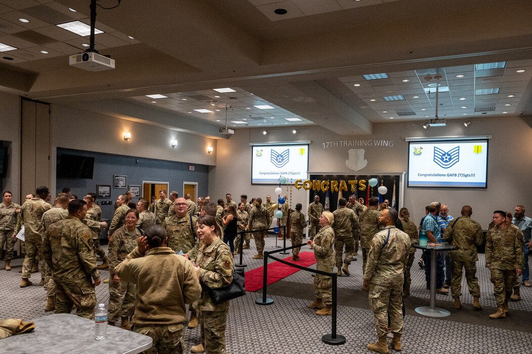 U.S. Air Force service members from Goodfellow Air Force Base along with family and friends of promotees socialize during the technical sergeant release party at the Powell Event Center, Goodfellow Air Force Base, Texas, Aug 3, 2023. Goodfellow held the release party to celebrate the selected members, which gave fellow wingmen and friends an opportunity to congratulate them on their success. (U.S. Air Force photo by Staff Sgt. Jermaine Ayers)