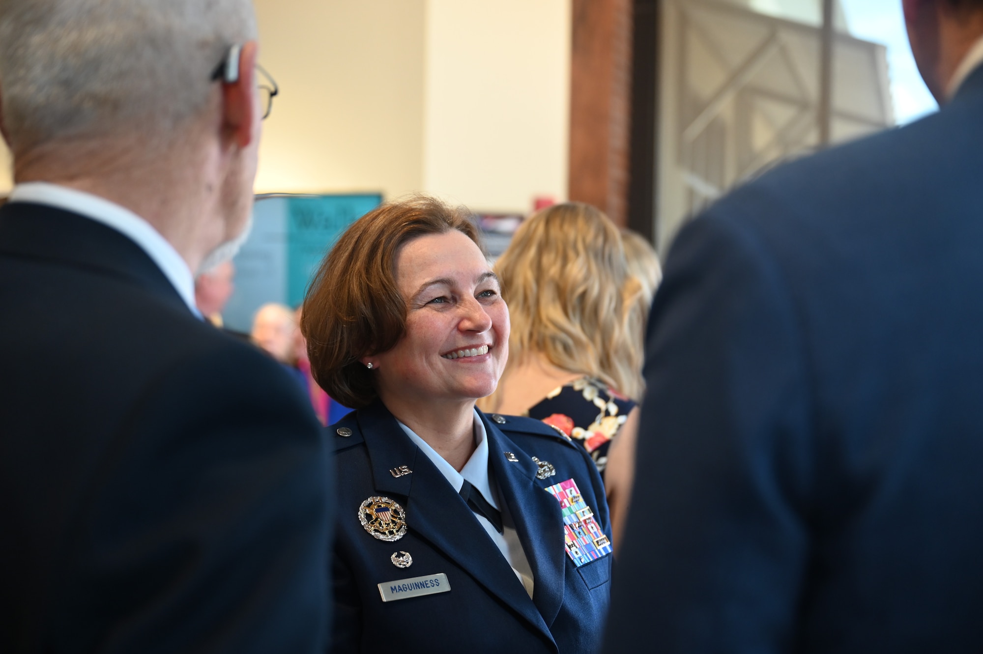 U.S. Air Force Col. Angelina Maguinness, 17th Training Wing commander, talks to event attendees during the Veteran Affairs Clinic renaming ceremony, San Angelo, Texas, July 31, 2023. She attended the event to talk about the lasting impact Charles and JoAnne Powell had on Goodfellow and the surrounding area. (U.S. Air Force photo by Airman 1st Class Madison Collier)