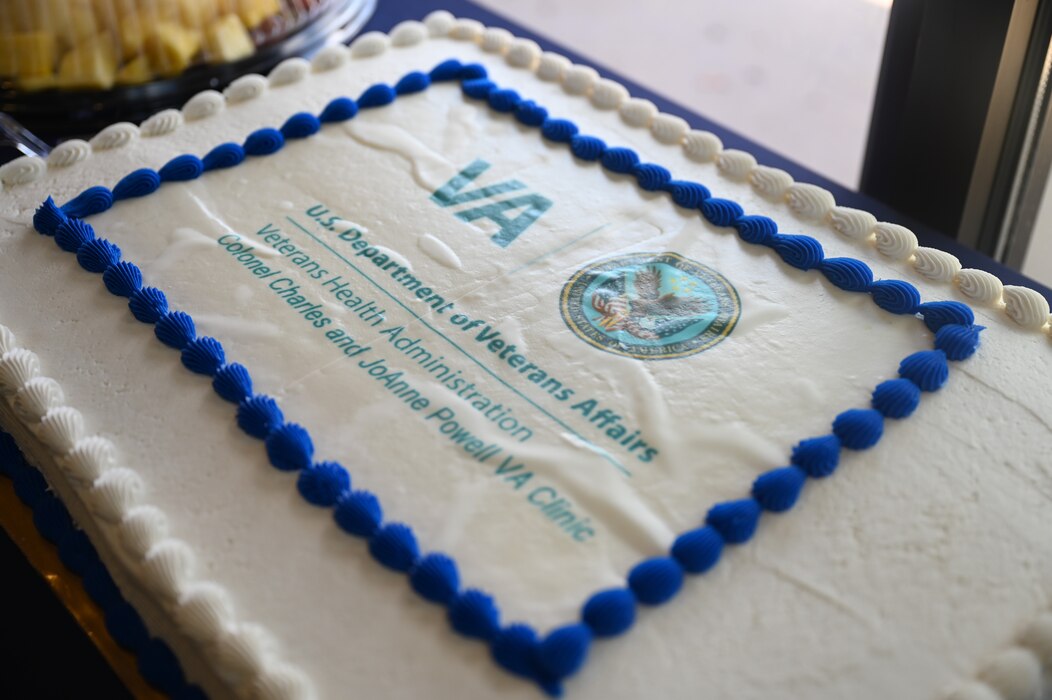 A cake decorated with the new name of the San Angelo Veteran Affairs Clinic to celebrate the renaming ceremony is on display during the Veteran Affairs Clinic renaming ceremony, San Angelo, Texas, July 31, 2023. Charles and JoAnne Powell’s legacy and impact on and off base has outlived them and will continue to help veterans within San Angelo. (U.S. Air Force photo by Airman 1st Class Madison Collier)