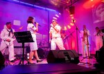 Chief Musician James Choate, (right center), from Mangum, Oklahoma, assigned to the U.S. 7th Fleet Band’s “Orient Express,” embarked aboard USS Blue Ridge (LCC 19), and Sersan II (Sergeant) Donna Sinta R, (left center), from the Indonesian National Military-Naval Forces’ TNI-AL, Indonesian Navy Band “Sea-Coustics,” perform in front of a live audience during a port visit in Jakarta, Indonesia July 28. The port visit reflects the United States’ commitment to the Indo-Pacific region and complements the many bilateral military cooperation activities conducted by the U.S. Navy and Indonesia.