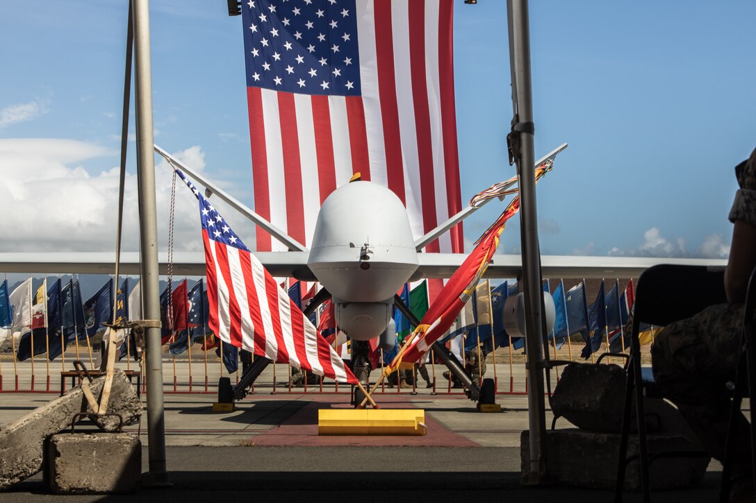 The U.S. Marine Corps MQ-9A MUX/MALE is formally unveiled during a ceremony for Marine Unmanned Aerial Vehicle Squadron 3 (VMU-3), Marine Aircraft Group 24, 1st Marine Aircraft Wing at Marine Corps Air Station Kaneohe Bay, Aug 2, 2023. The ceremony commemorated the squadron’s years of dedicated effort and work to reach Initial Operational Capability with the MQ-9A. VMU-3 can support the Marine Air-Ground Task Force by providing multi-surveillance and reconnaissance, data gateway and relay capabilities, and enabling or conducting the detection and cross cueing of targets and facilitating their engagement during expeditionary, joint and combined operations.(U.S. Marine Corps photo by Cpl. Christian Tofteroo)