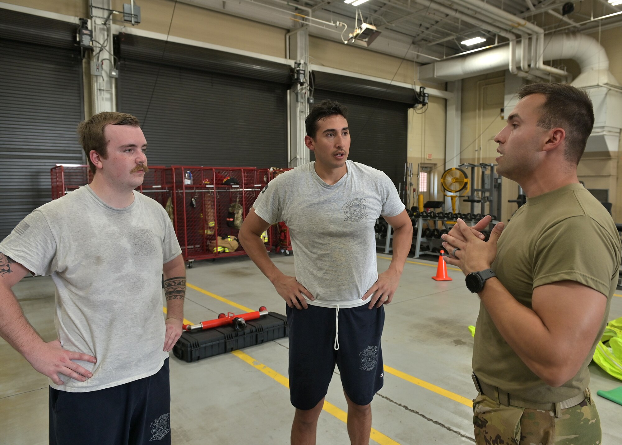 Firefighters receive feedback after training.