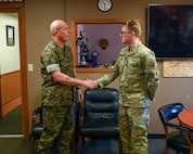 U.S. Marine Corps Sgt. Maj. Howard L. Kreamer, U.S. Strategic Command (USSTRATCOM) Senior Enlisted Leader, eats breakfast with noncommissioned officers at Minot Air Force Base, North Dakota, Aug. 2, 2023. During the breakfast, Kreamer answered questions about USSTRATCOM, and gave advice on how to enhance their leadership skills. (U.S. Air Force photo by Senior Airman Evan Lichtenhan)