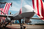 The U.S. Marine Corps MQ-9A MUX/MALE is formally unveiled during a ceremony for Marine Unmanned Aerial Vehicle Squadron 3 (VMU-3), Marine Aircraft Group 24, 1st Marine Aircraft Wing at Marine Corps Air Station Kaneohe Bay, Aug 2, 2023. The ceremony commemorated the squadron’s years of dedicated effort and work to reach Initial Operational Capability with the MQ-9A. VMU-3 can support the Marine Air-Ground Task Force by providing multi-surveillance and reconnaissance, data gateway and relay capabilities, and enabling or conducting the detection and cross cueing of targets and facilitating their engagement during expeditionary, joint and combined operations.(U.S. Marine Corps photo by Cpl. Christian Tofteroo)