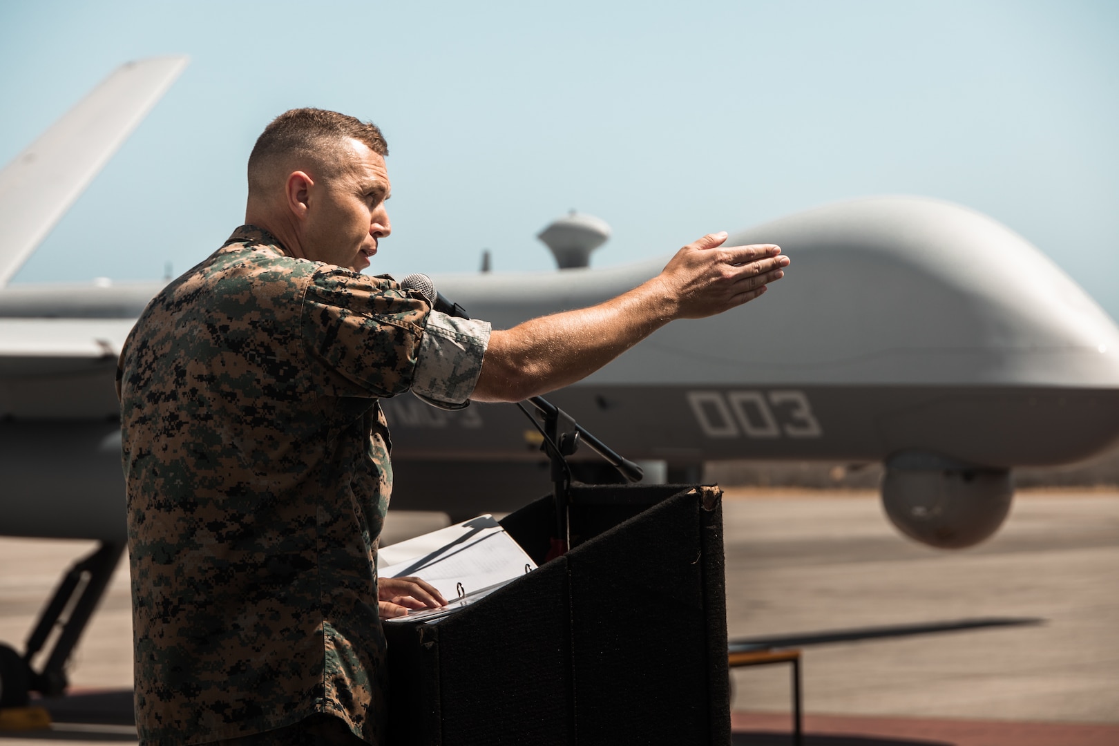U.S. Marine Corps Lt. Col. Nicholas B. Law addresses the audience during a ceremony for Marine Unmanned Aerial Vehicle Squadron 3 (VMU-3), Marine Aircraft Group 24, 1st Marine Aircraft Wing at Marine Corps Air Station Kaneohe Bay, Aug 2, 2023. The ceremony commemorated the squadron’s years of dedicated effort and work to reach Initial Operational Capability with the MQ-9A. VMU-3 can support the Marine Air-Ground Task Force by providing multi-surveillance and reconnaissance, data gateway and relay capabilities, and enabling or conducting the detection and cross cueing of targets and facilitating their engagement during expeditionary, joint and combined operations. (U.S. Marine Corps photo by Cpl. Christian Tofteroo)