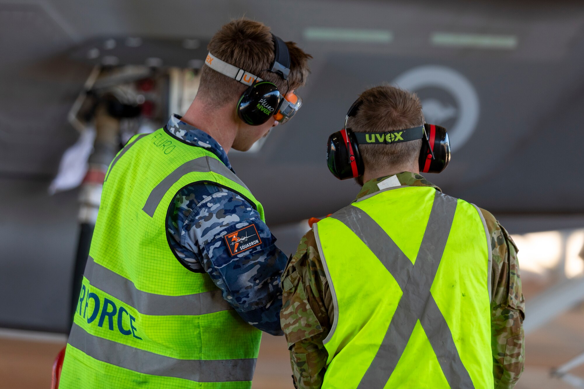 Royal Australian Air Force (RAAF) Avionics Fitter Leading Aircraftman Isaac Fleury from No. 3 Squadron and Ground Support Equipment Technician Corporal Mitchell Petty from No. 13 Squadron conduct checks on an F-35A Lightning ll during refueling at RAAF Base Curtin, Western Australia, as part of Talisman Sabre 2023. Talisman Sabre is a bilateral exercise that helps build and maintain trust and interoperability among key allies through shared experiences and tough, realistic training. (Royal Australian Air Force courtesy photo by LACW Annika Smit)