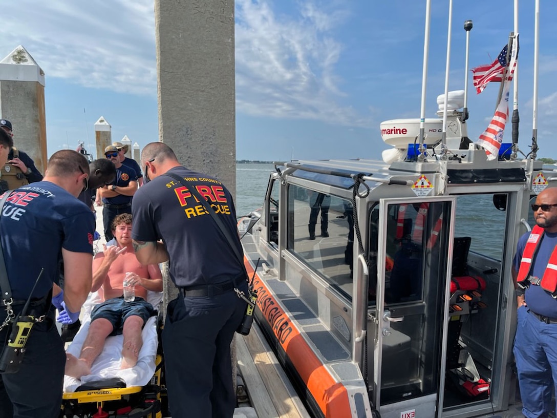 EMS transfer Charles Gregory to a local hospital after Coast Guard crews rescued him off a partially submerged 12-foot jon boat 12 miles offshore St. Augustine, Florida, Aug. 5, 2023. Charles departed the Lighthouse Park Boat Ramp Thursday night and his parents reported he was missing to Coast Guard Sector Jacksonville watchstanders. (U.S. Coast Guard photo, courtesy Coast Guard Station Mayport)