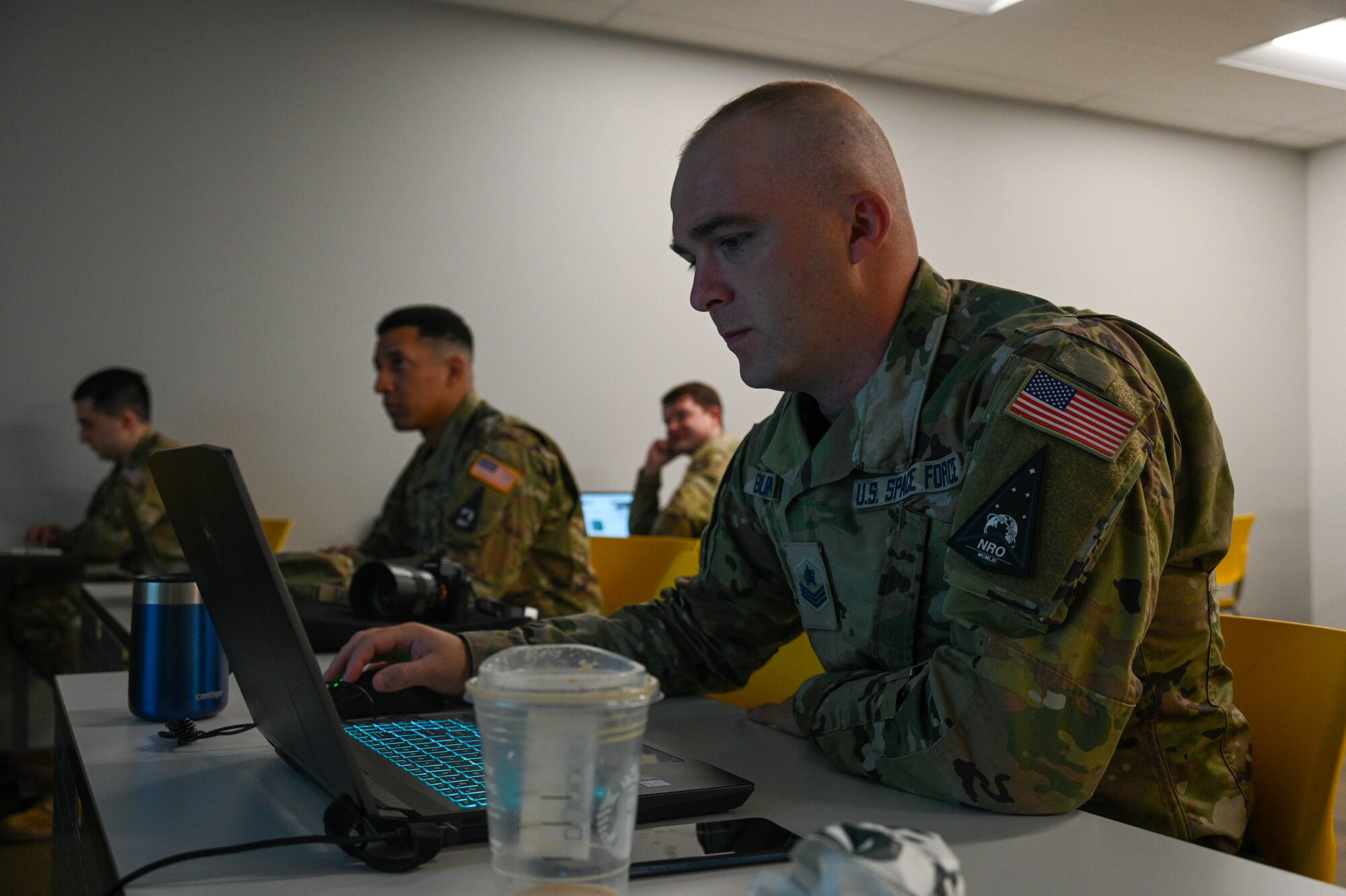 U.S. Space Force Guardian works on his computer.
