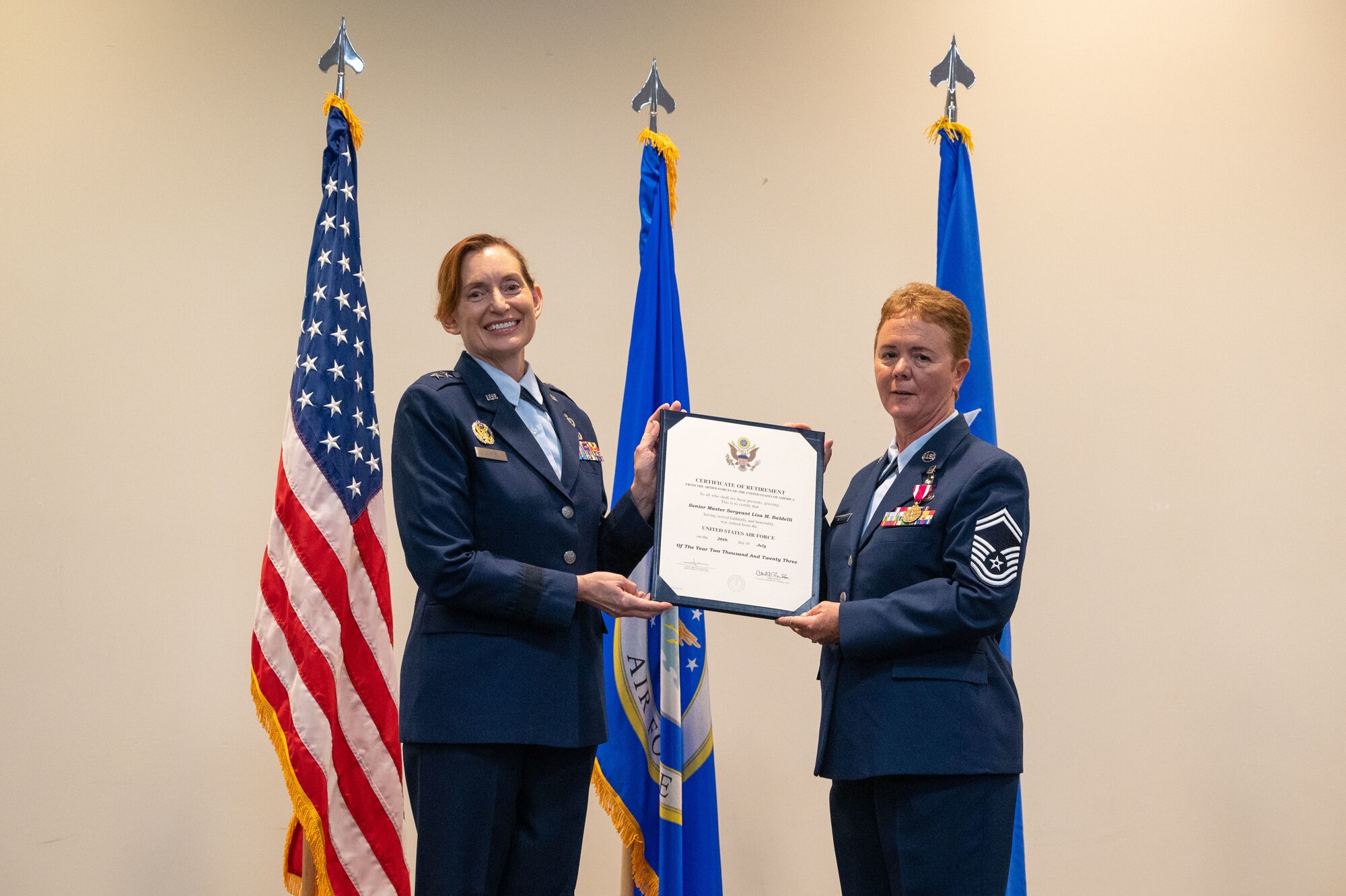 Gunter and Baldelli hold a certificate between them