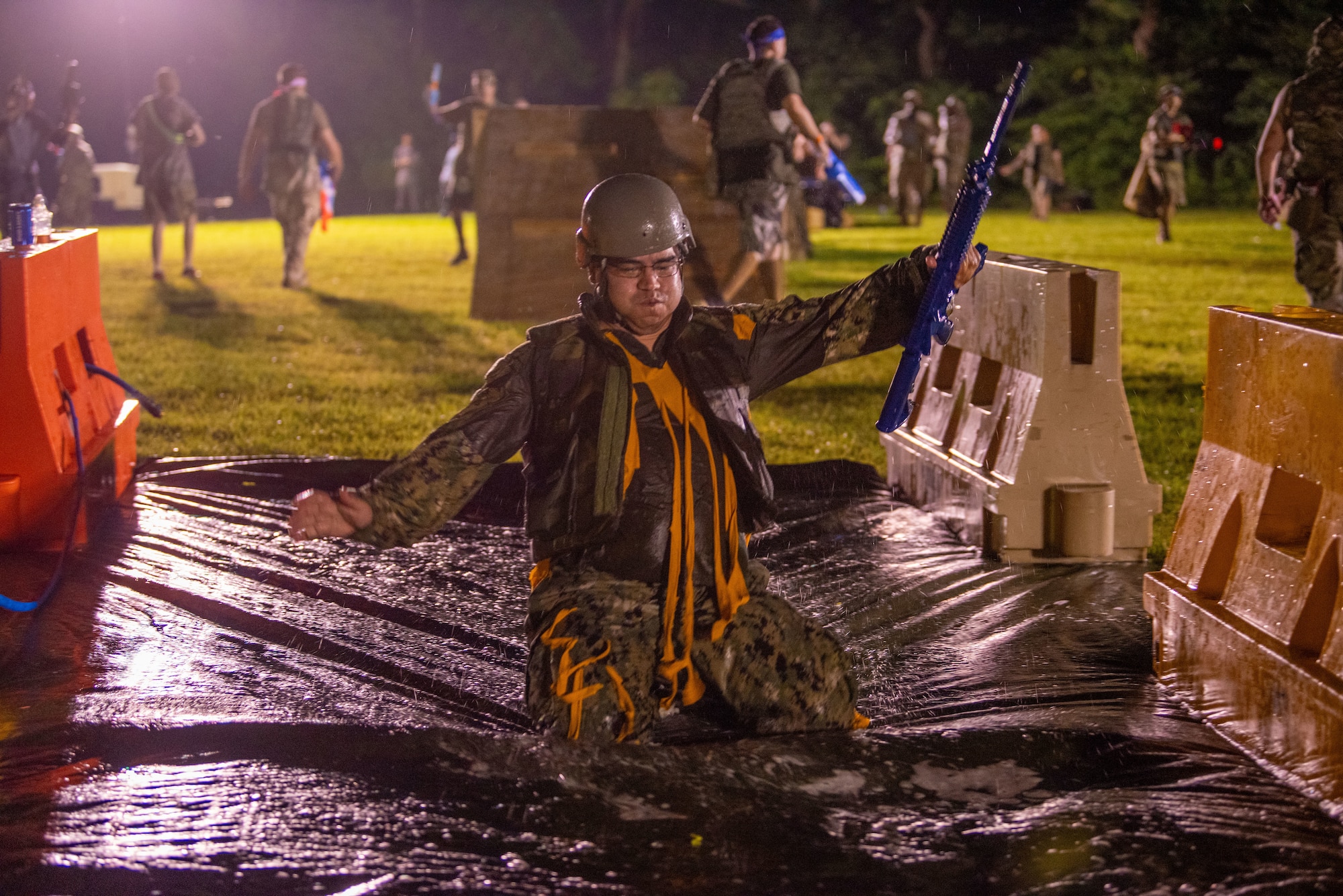 A member from Team Misawa slides through an obstacle course during Misawa’s first joint enlisted bilateral combat dining-in event at Misawa Air Base, Japan, July 28, 2023.