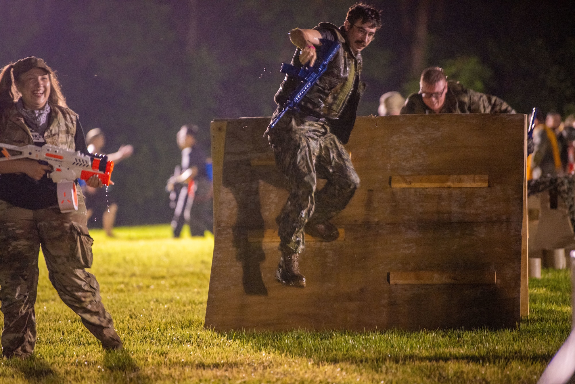 A member of Team Misawa leaps over a wall in an obstacle course during Misawa’s first joint enlisted bilateral combat dining-in event at Misawa Air Base, Japan, July 28, 2023.