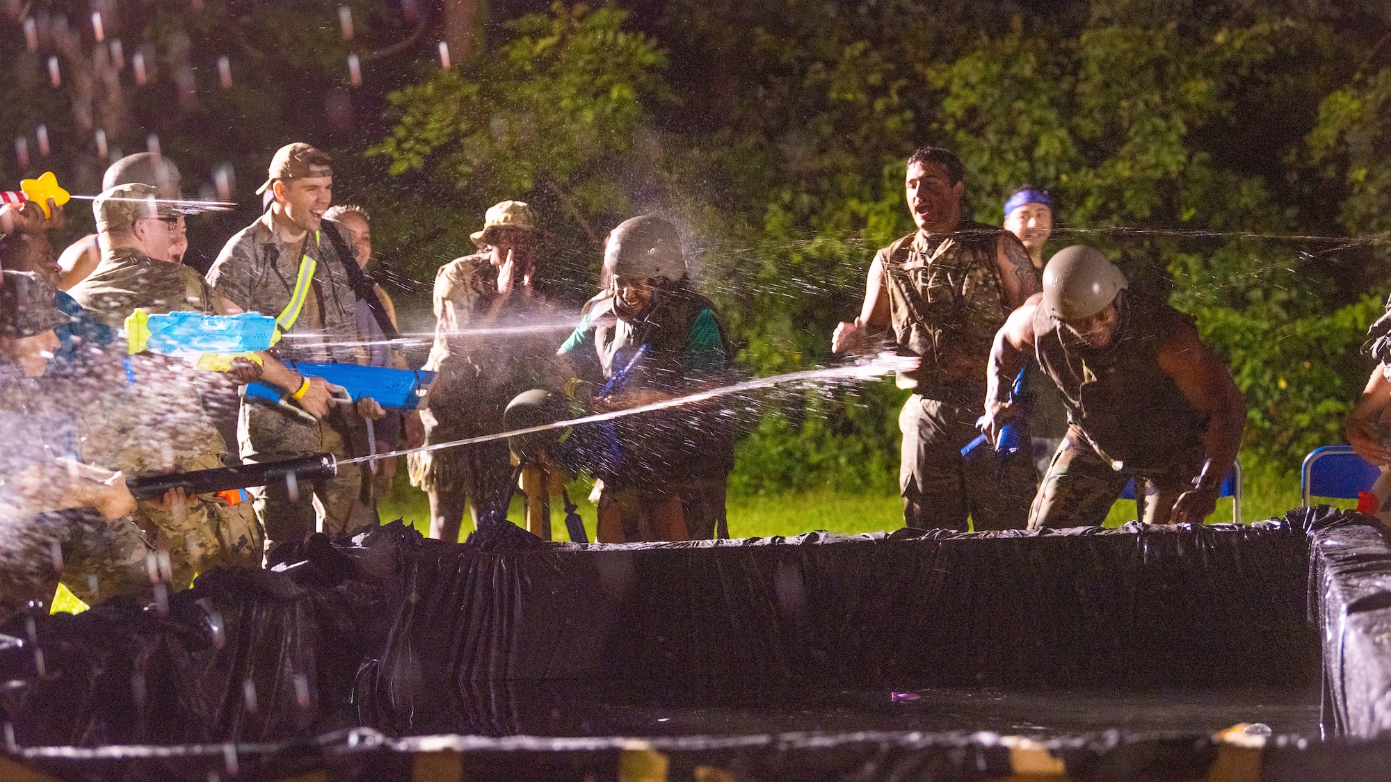 Members of Team Misawa prepare to run through an obstacle course during Misawa’s first joint enlisted bilateral combat dining-in event at Misawa Air Base, Japan, July 28, 2023.