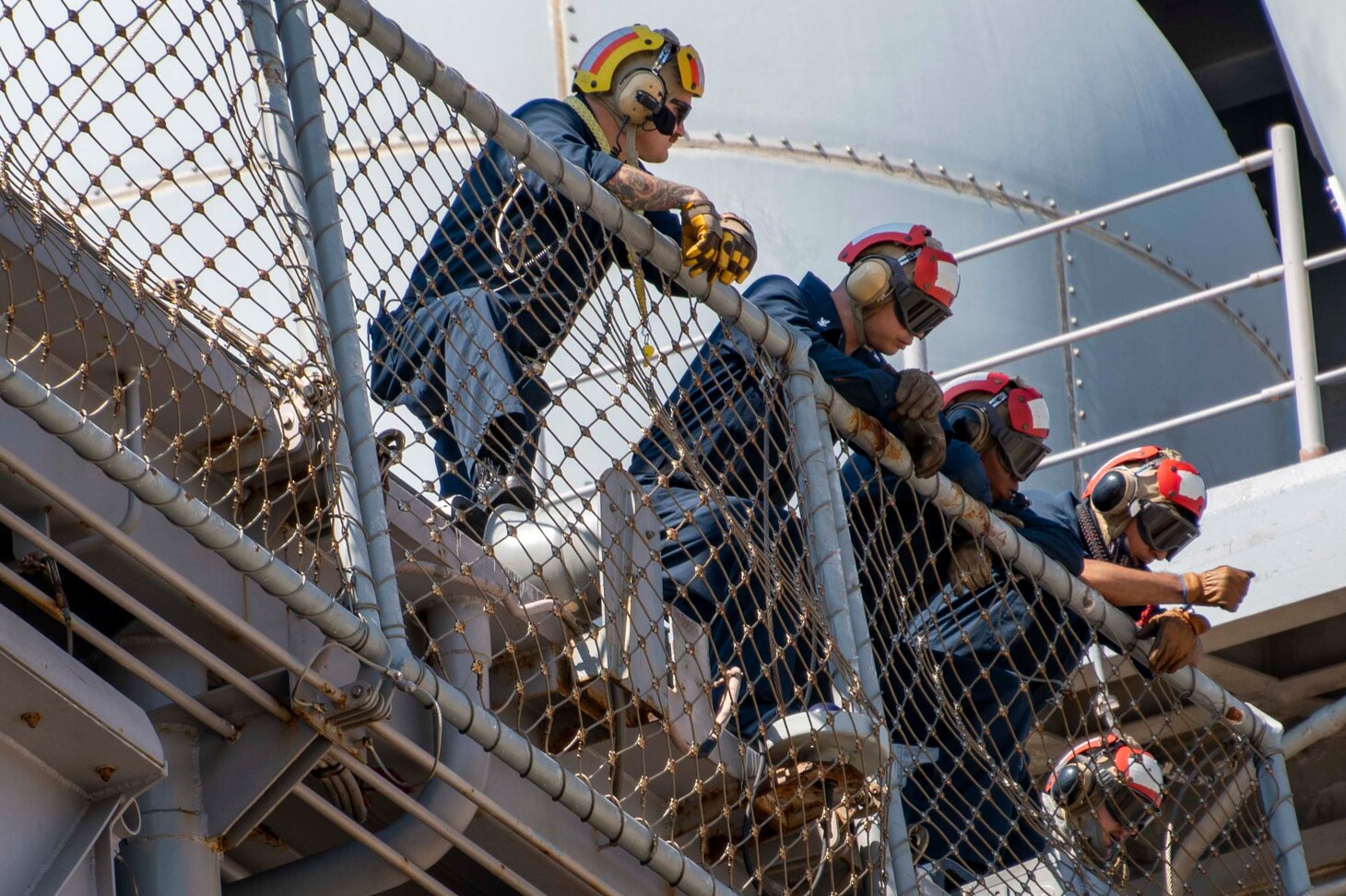 Sailors assigned to the Wasp-class amphibious assault ship USS Bataan (LHD 5) prepare to moor at the NATO Marathi Pier Complex on Aug. 2, 2023.  Naval Support Activity Souda Bay provided fuel and personnel support services to USS Bataan while in port.