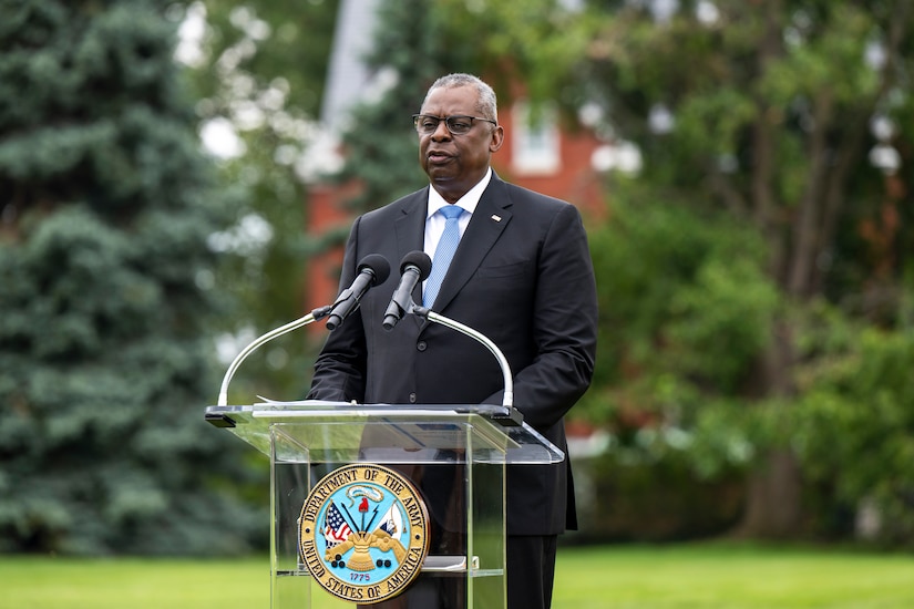 A man speaks at a podium.