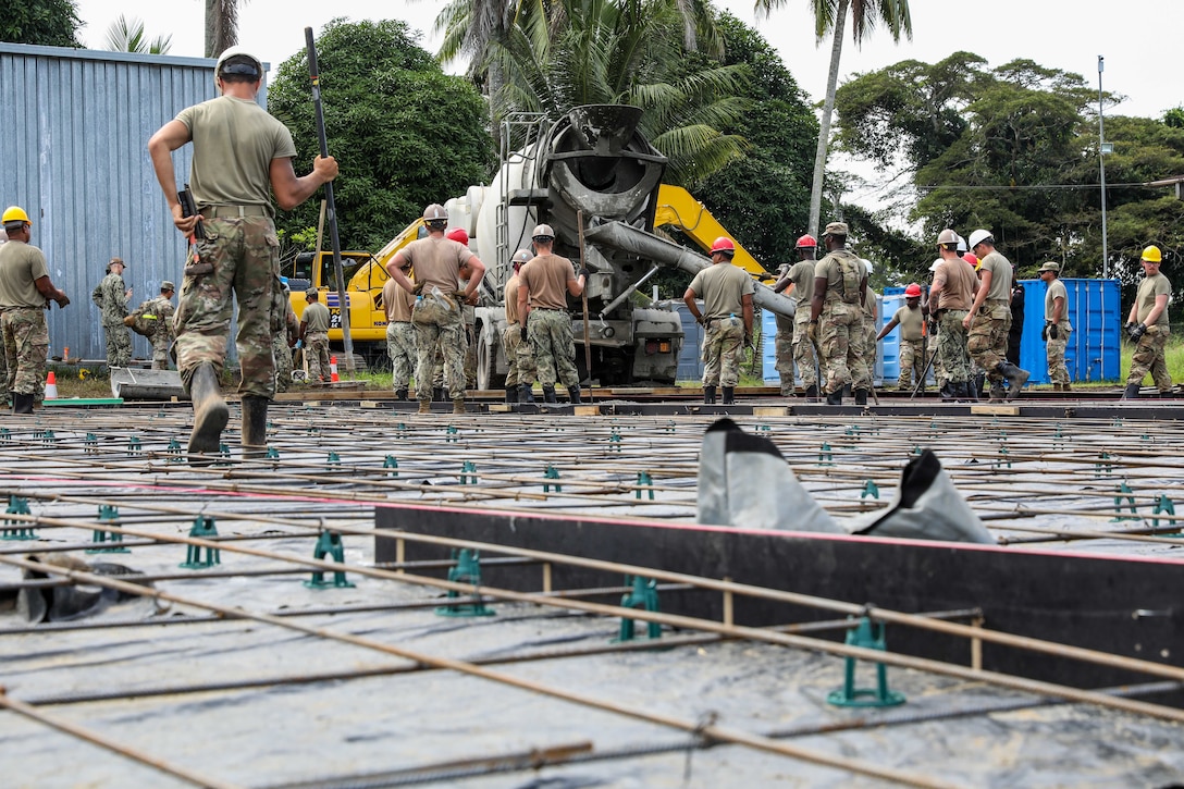 Army Engineers with 84th Engineer Battalion, 130th Engineer Brigade, 8th Theater Sustainment Command, Marine Engineers with Combat Logistics Battalion 11, and Navy Seabees with Naval Mobile Construction Battalion Three laid the foundation for future tent pads with support and oversight from Papua New Guinea Defence Force Engineer Battalion Engineers during Exercise Tamiok Strike 2023, Igam Barracks, Lae, Papua New Guinea, August 1, 2023.