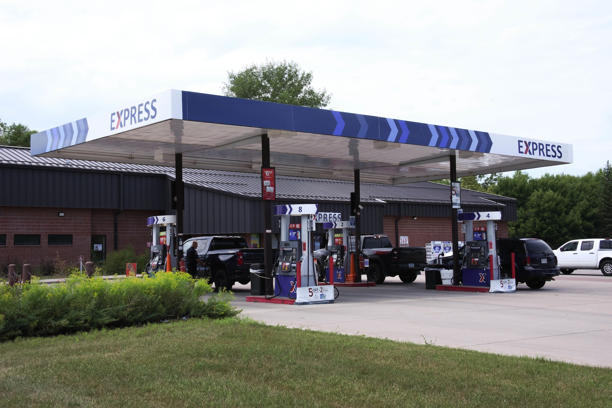 Vehicles at a gas station.
