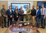 Naval Surface Warfare Center Panama City Division and Sagetech Avionics, Inc., enter into a Cooperative Research and Development Agreement during a signing ceremony, July 27. (left to right) Lt. Rich Morales, NSWC PCD acting executive officer, Wes Shover, Sagetech Sales and Channel director, Paige George, NSWC PCD Technology Transfer manager, Tom Furey, Sagetech CEO, Capt. David Back, NSWC PCD commanding officer, Ryan Kendall, NSWC PCD Test and Evaluation and Prototype Fabrication Division mechanical engineer, Gavin Taylor NSWC PCD electrical engineer, and Dr. Kerry Commander, NSWC PCD chief technology officer. (U.S. Navy photo by Ronnie Newsome)