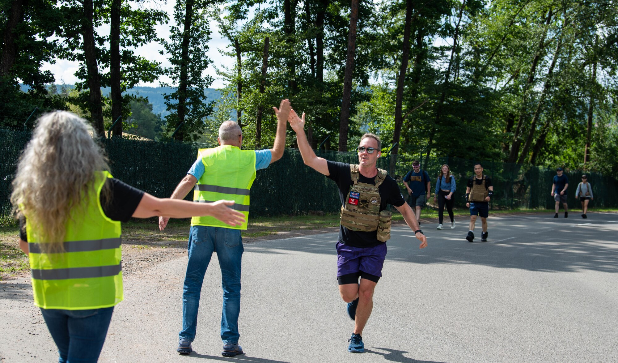 Runners get high fives from volunteers.