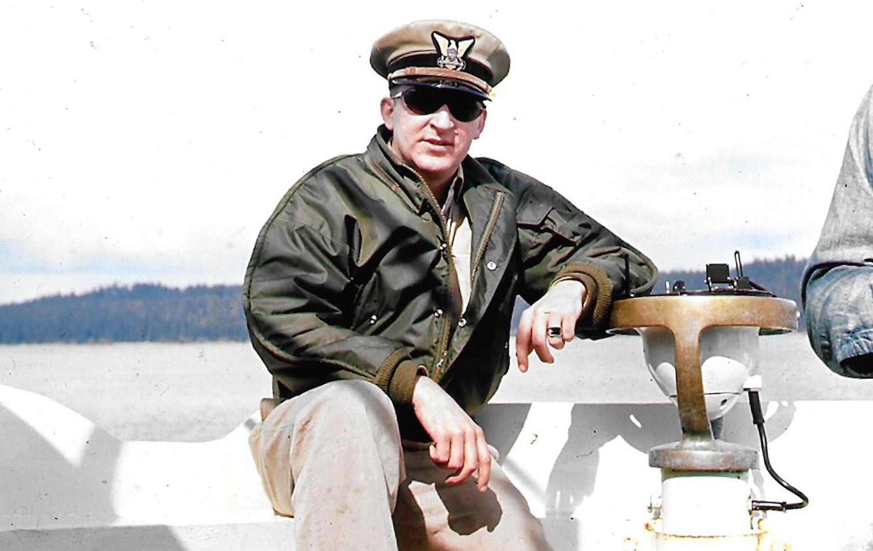 Color photograph of the author, then Lt. Wayne Wheeler, on the bridge of Ironwood (WLB-297) in its home waters of Alaska. (Courtesy of the author)