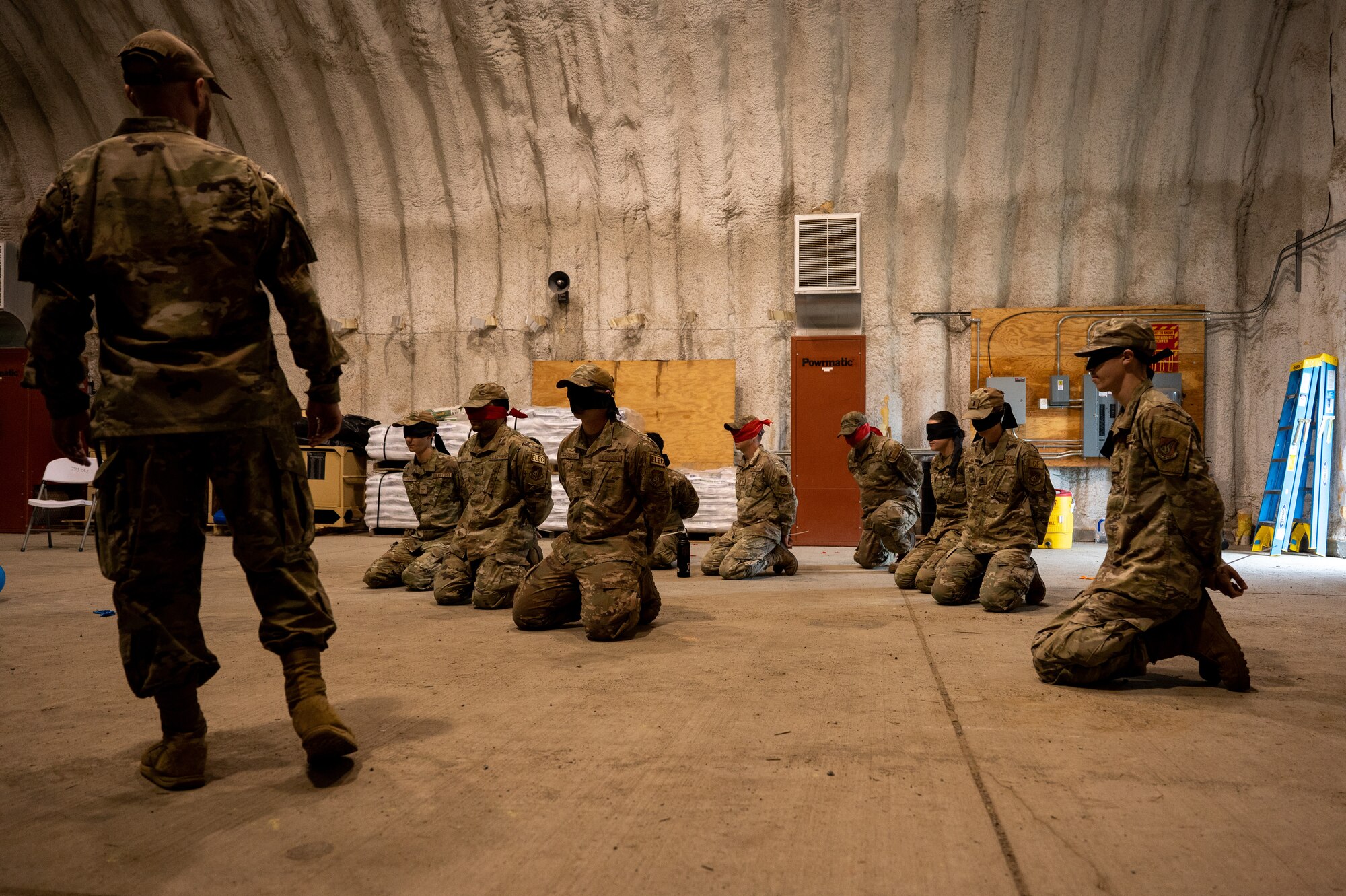 A photo of a group of blindfolded Airmen