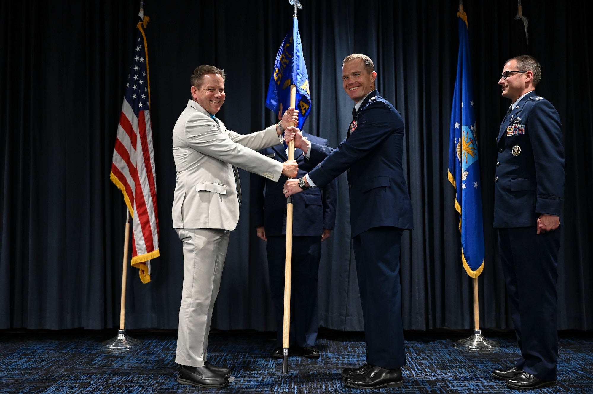 A man passes a guidon.